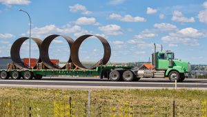 Flatbed transporting steel coils to MExico